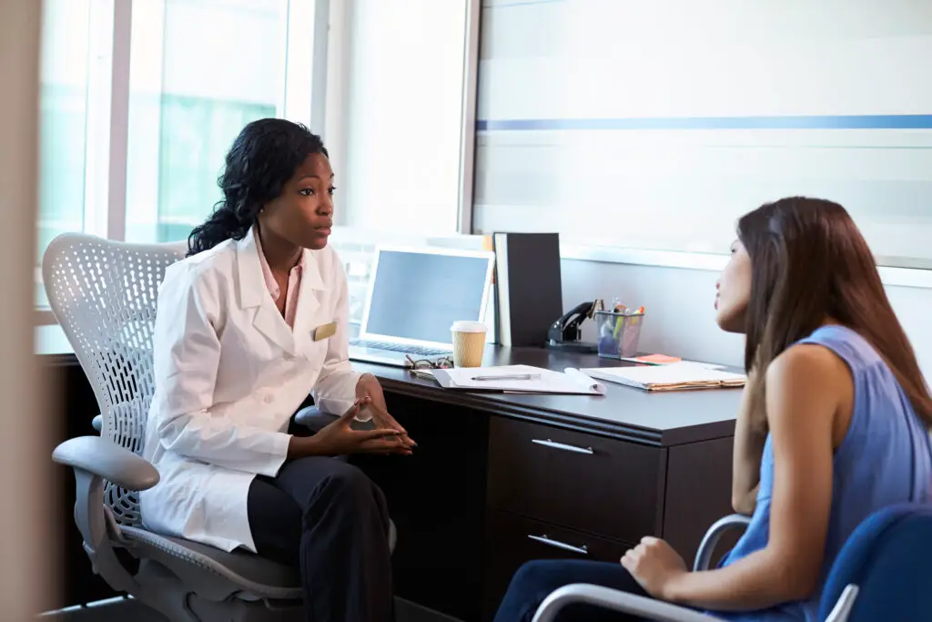 Woman doctor discussing patient care in an office
