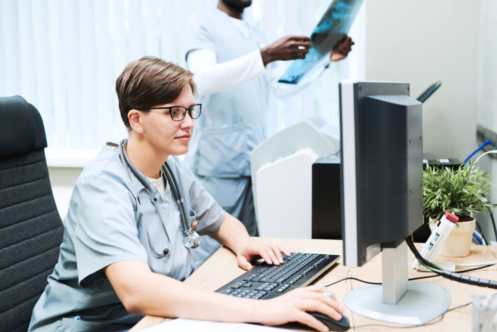 Doctor working with a computer in an office